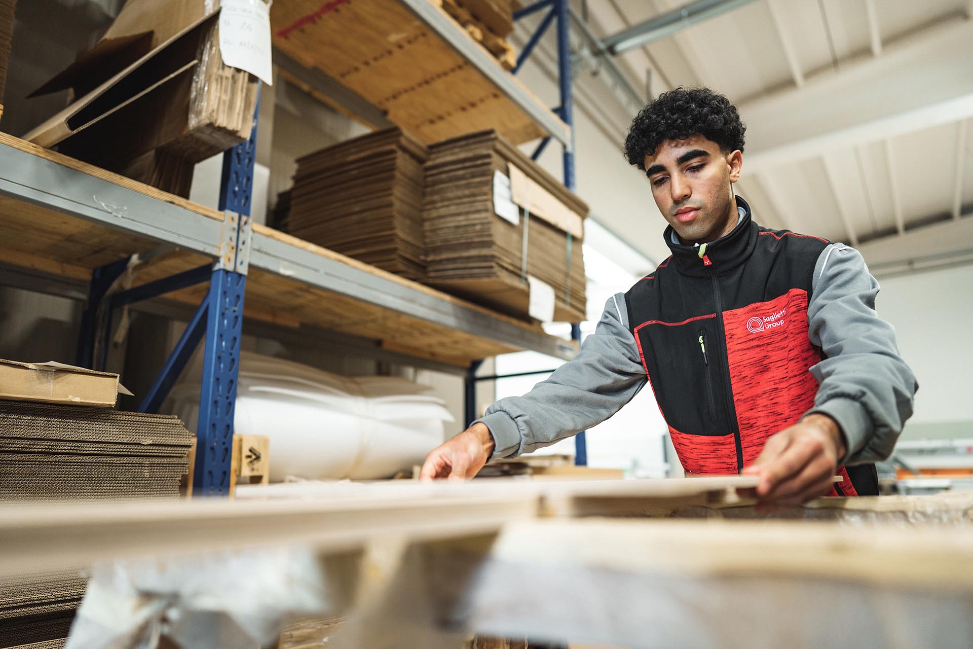 Worker packing flat-pack display parts in the warehouse